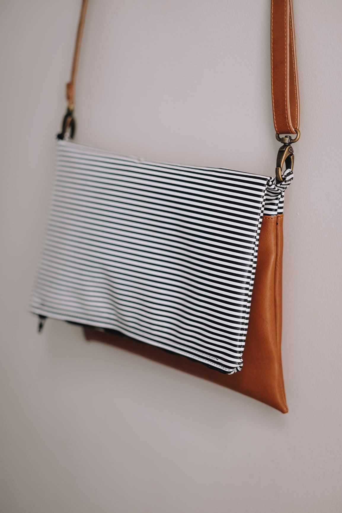 Cross-body foldover clutch
