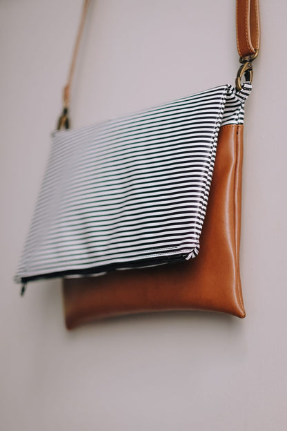 Cross-body foldover clutch