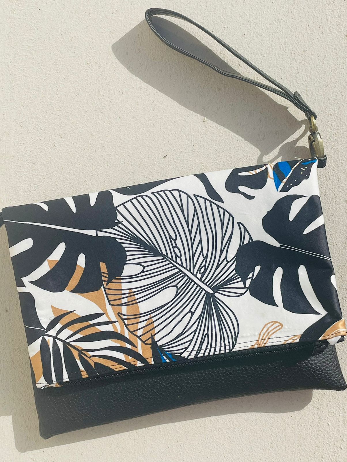 Cross-body foldover clutch