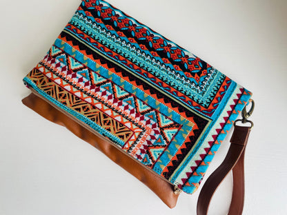 Cross-body foldover clutch