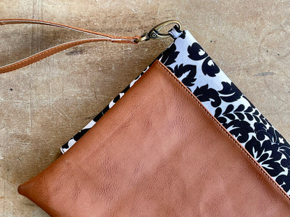 Cross-body foldover clutch